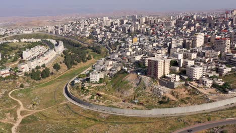 aerial view of a city divided by a concrete separation wall