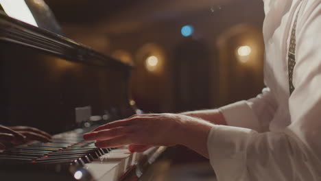 close up of musician playing piano