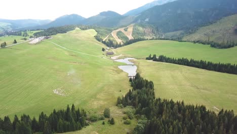 forward drone shot over a mountain valley in tatras, slovakia, europe