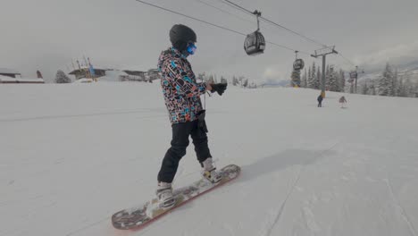 snowboarder going down a  slope of aspen. winter extreme sports concept