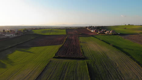 aerial shot of a farm in a beautiful countryside on a sunny day