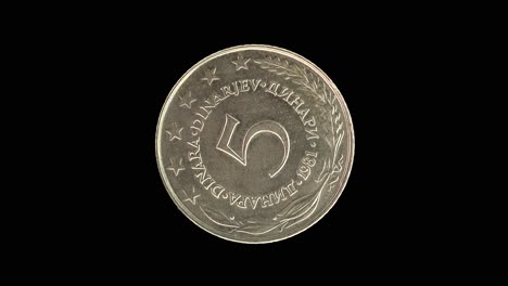 yugoslavia 1981 5 dinara coin reverse with denomination rotating on black background