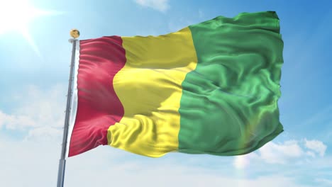 guinea flag waving in the wind against deep blue sky. national theme, international concept. 3d render seamless loop 4k