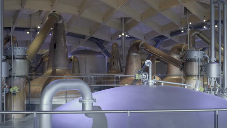 interior pipework, copper stills and mash tuns highlighting the architecture and complexity of a modern scottish whisky distillery