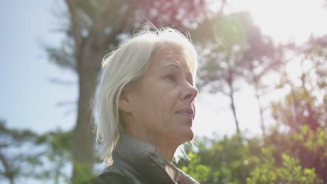 side view of senior woman in the forest