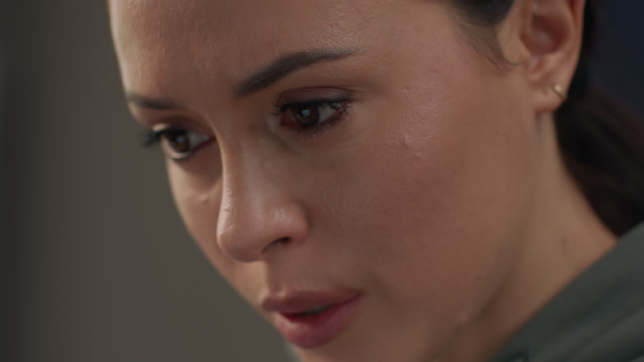 Close Up On Face Of Anxious Woman Sitting Indoors On Sofa Working From Home Using Laptop Worried About Cost Of Living Crisis 1