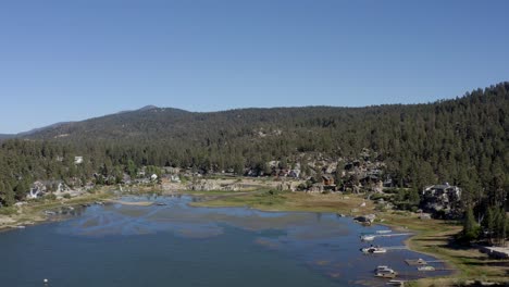 a beautiful drone shot flying towards a bay at big bear lake in san bernardino county, california