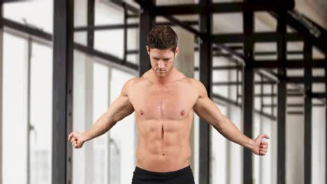 Animation-of-muscular-caucasian-man-warming-up-over-modern-gym