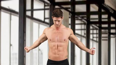 animation of muscular caucasian man warming up over modern gym