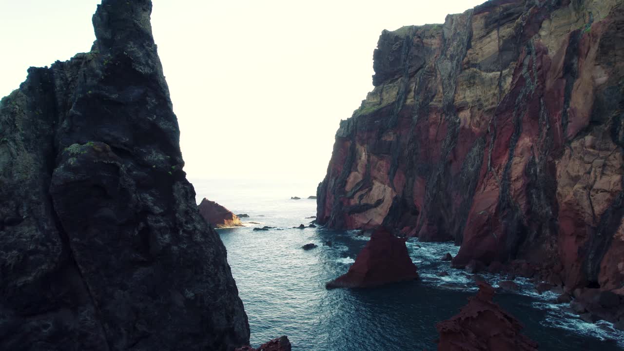 Aerial of High Rocky Cliffs Above the Ocean, Sunny Day