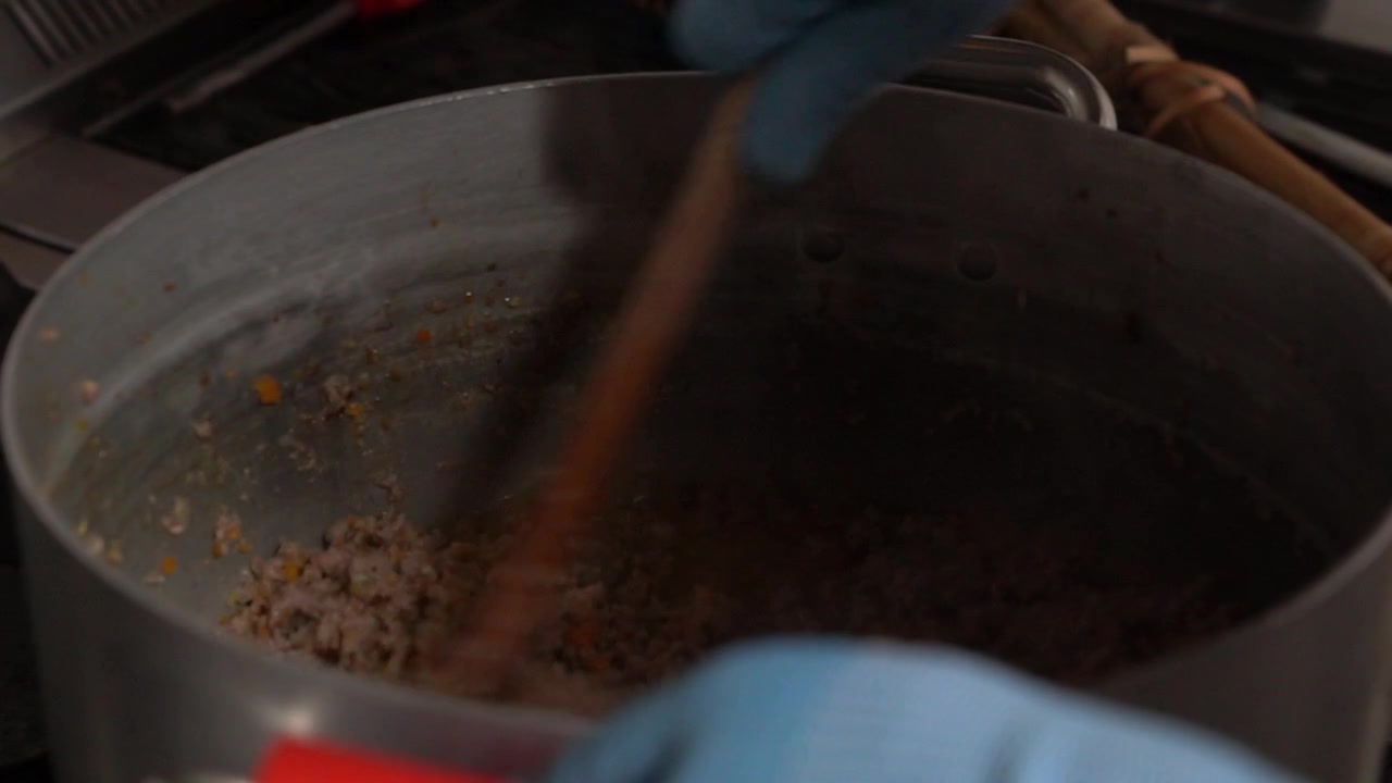 Prearation od a seasoning for pasta, made by meat and various vegetables like carrots, soothe, onions, etc