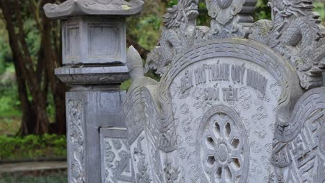 detailed carvings on a historic vietnamese tombstone