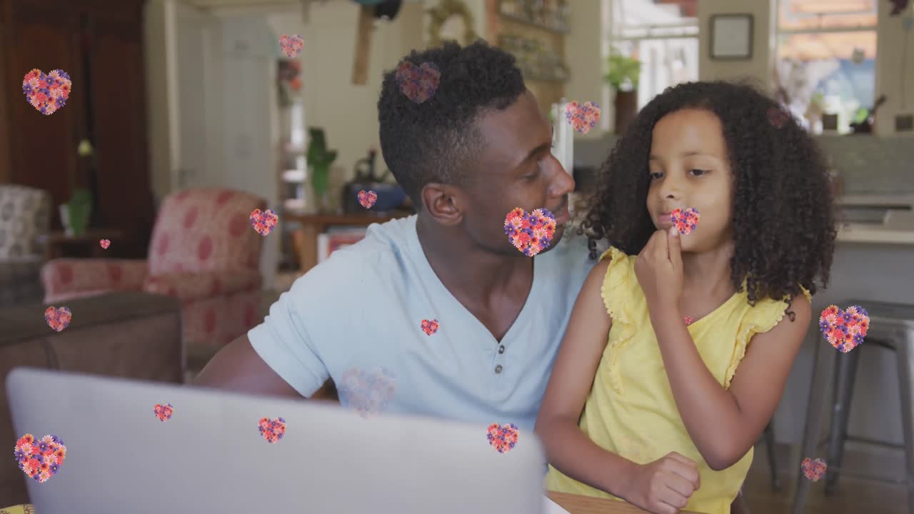 Animazione di cuori floreali su padre e figlia afroamericani felici che si scambiano un cinque