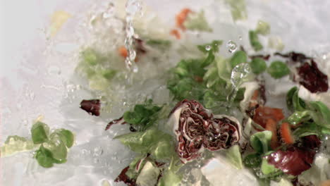 lettuce falling into water in super slow motion