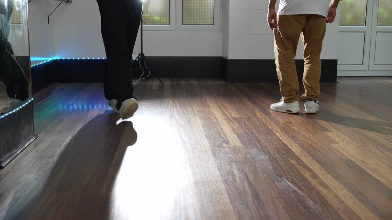 People dancing on a wooden floor