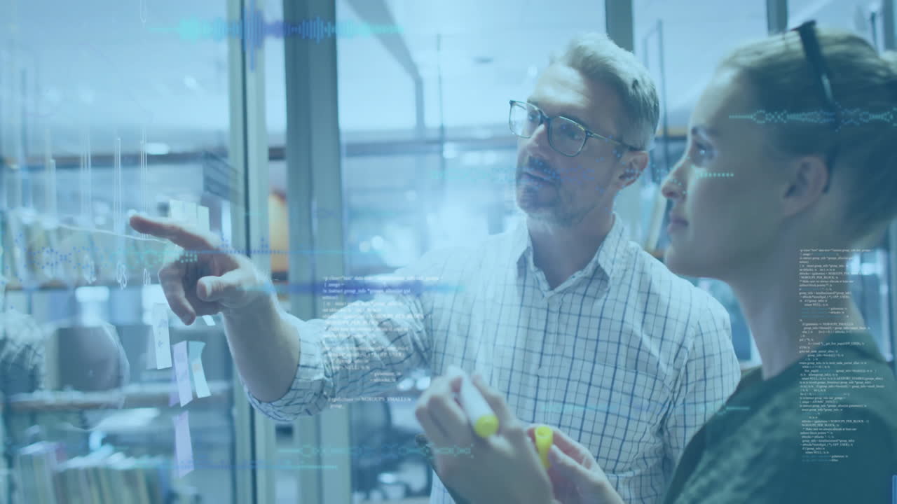 business team presenting strategy on glass wall with sticky notes, showing charts and code overlays