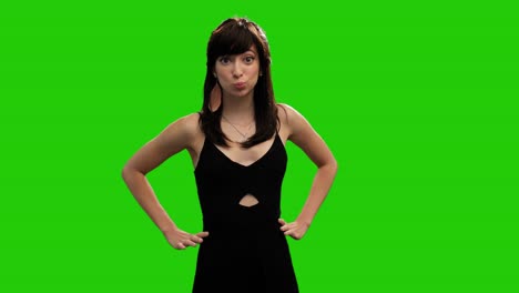 cute caucasian girl in black dress surprised on green screen