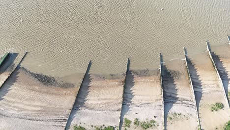 Groins-on-beach-Whitstable-Kent-UK-Overhead-birds-eye-drone-aerial-view