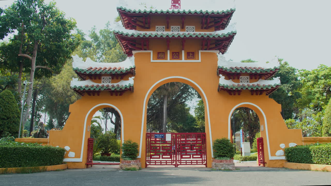 Family of Three Entering Territory of Asian Temple