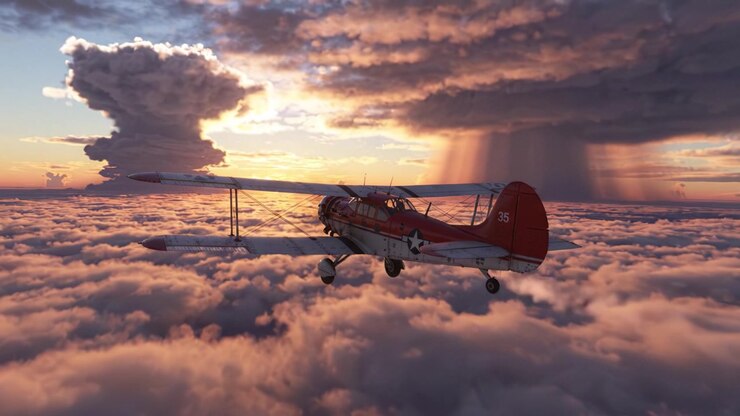 Prachtig luchtbeeld van een vintage tweedekker die door pluizige wolken zweeft onder een levendige zonsonderganglucht, wat de schoonheid van de natuur en de sensatie van het vliegen toont.