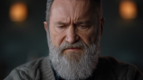 Portrait-senior-man-looking-laptop-computer-indoors.-Closeup-old-man-face