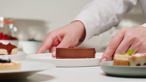 chef serving chocolate cake and other desserts