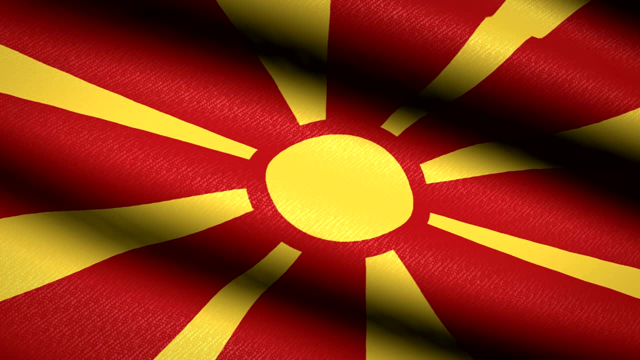 bandera de macedonia ondeando fondo textil con textura. animación de bucle sin costuras. pantalla completa. movimiento lento. video en 4k
