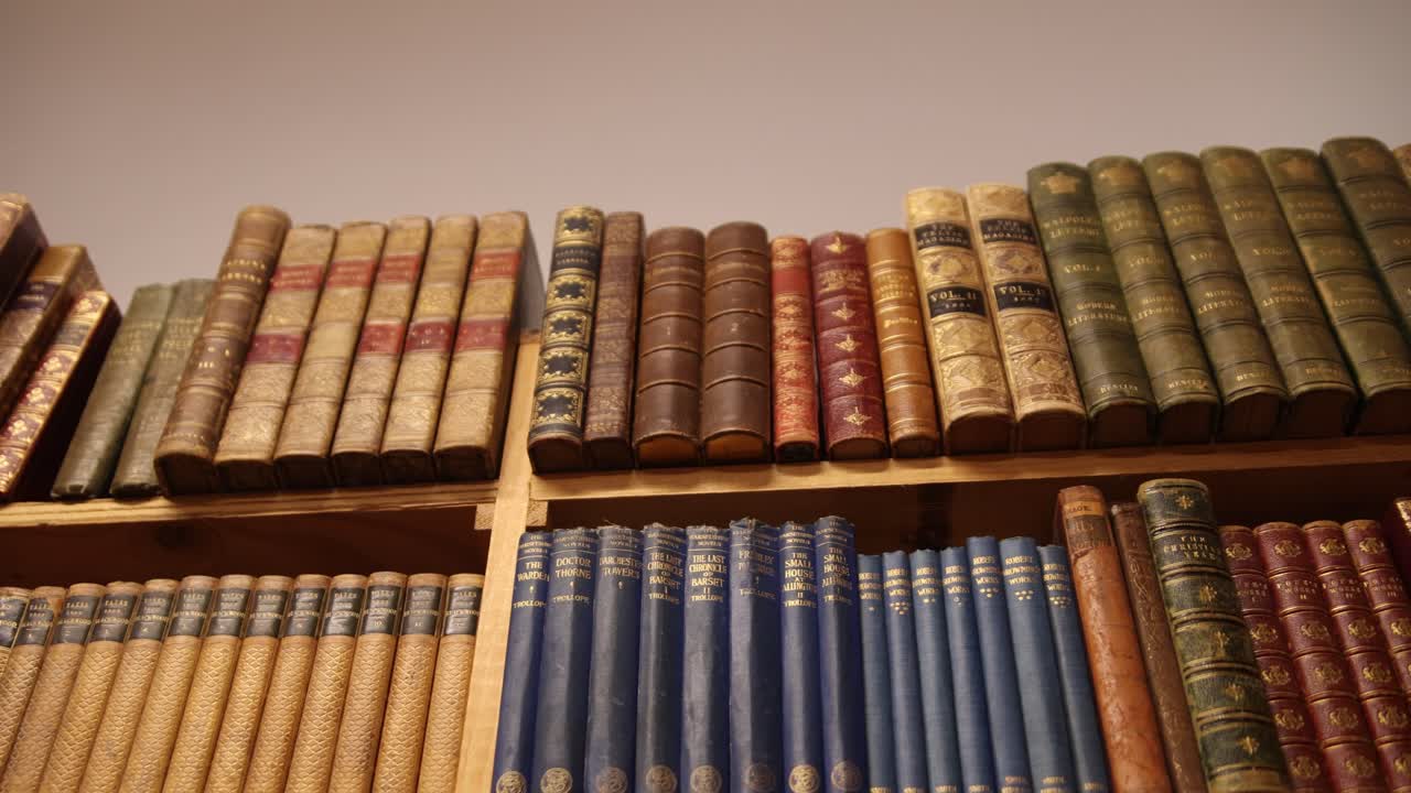 old vintage leather books along a book shelf in the famous leakeys book store in Inverness, Scotland in the Highlands