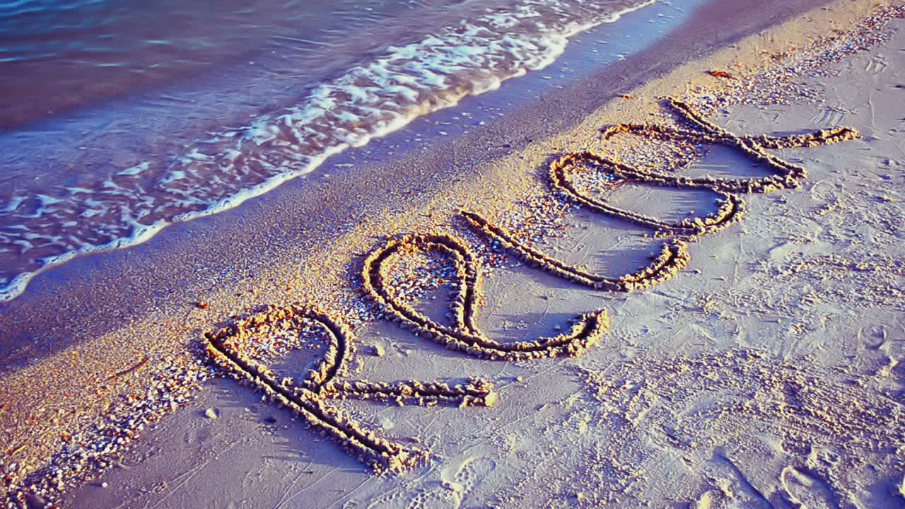 Inscription a relax on sand. Inscription on sand, the beach