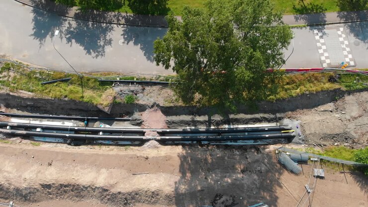 Heating pipelines in the trench, Aerial top down shot