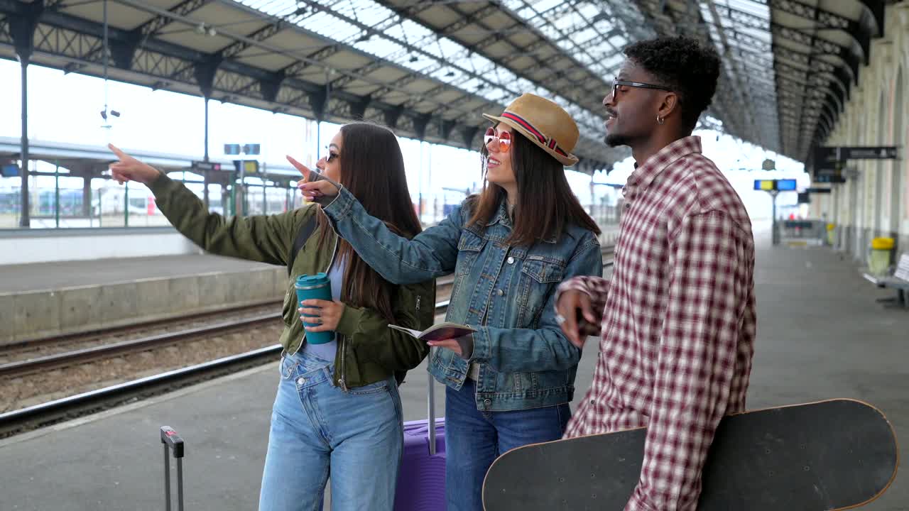 Friends waiting for train at a train station