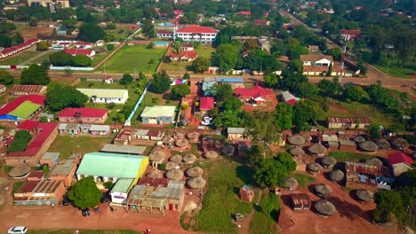 aerial view of traditional african huts and modern buildings in gulu town, uganda.