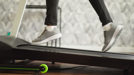 a woman running on a treadmill