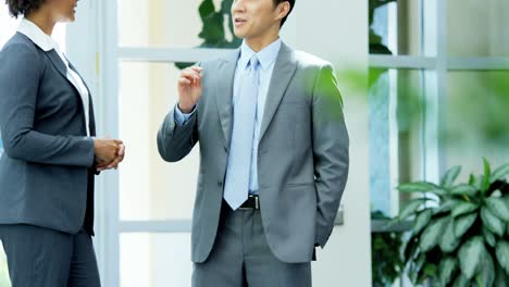 ambitious multi ethnic business executives in office meeting