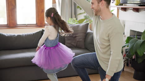 family, happy father and girl dance in living room