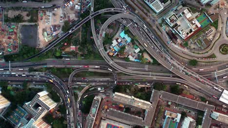 Downtown-Hong-Kong-city-skyscrapers-and-urban-traffic,-Aerial-view