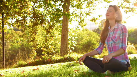 woman sitting cross-legged calm and serene