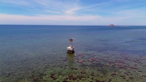 semi orbit aerial view capturing the vivid coral textures and turquoise waters of my hoa lagoon in phan rang, vietnam.