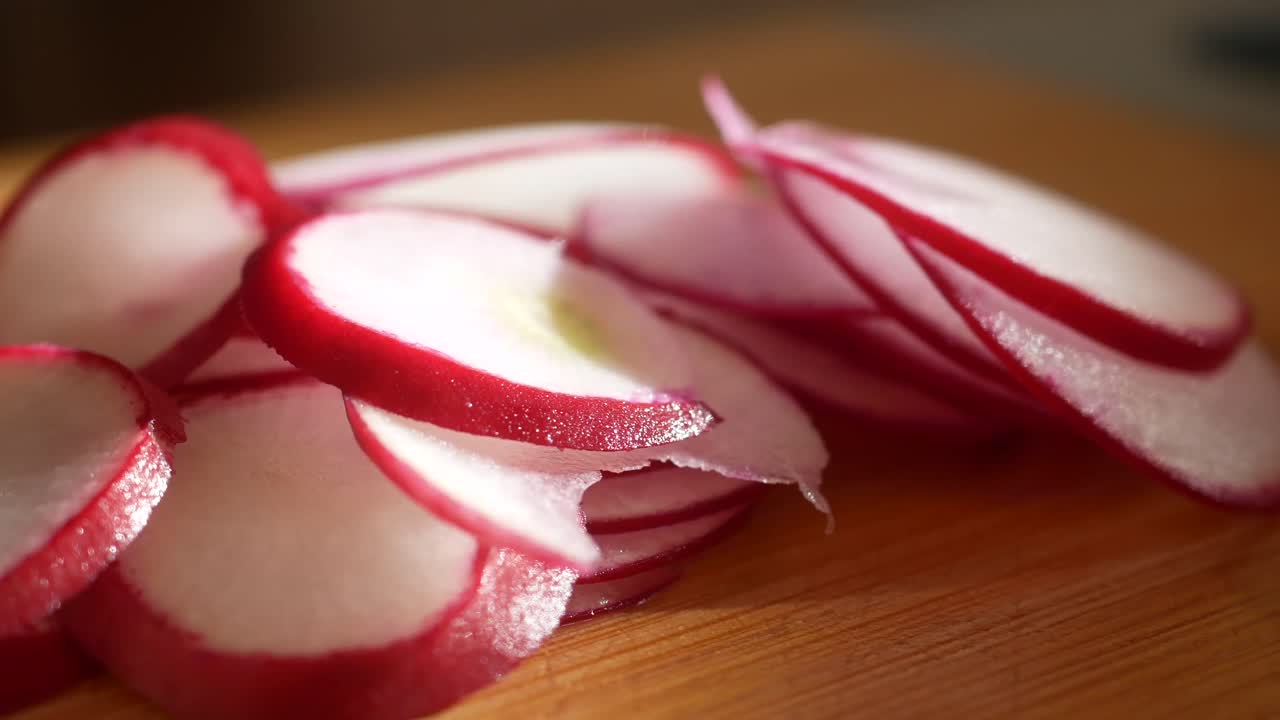 Sliced Radishes on a Wooden Board