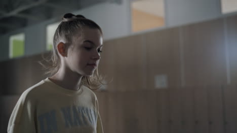 Teen-school-girl-jumping-on-break-closeup.-Student-enjoying-rubber-band-game.