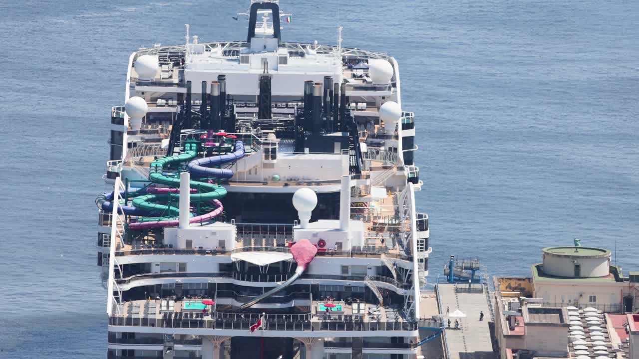 Cruise ship with colorful water slides in Naples