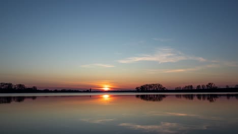 sunset timelapse over a glassy calm lake