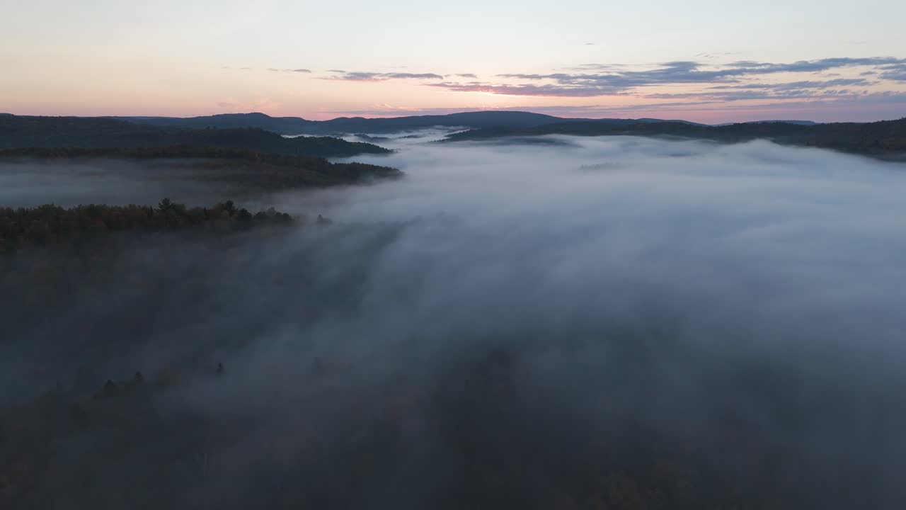 drone fly above the clouds at sunrise in scenic mountains landscape , aerial calm meditative Mother Earth footage