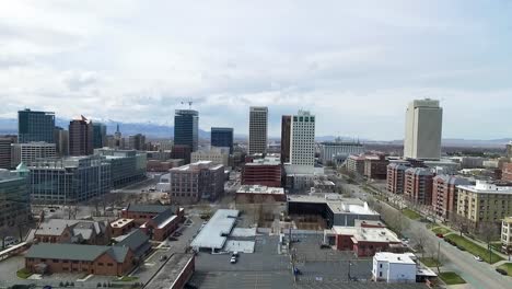 aerial shot pulling away from the skyscrapers in salt lake city, utah