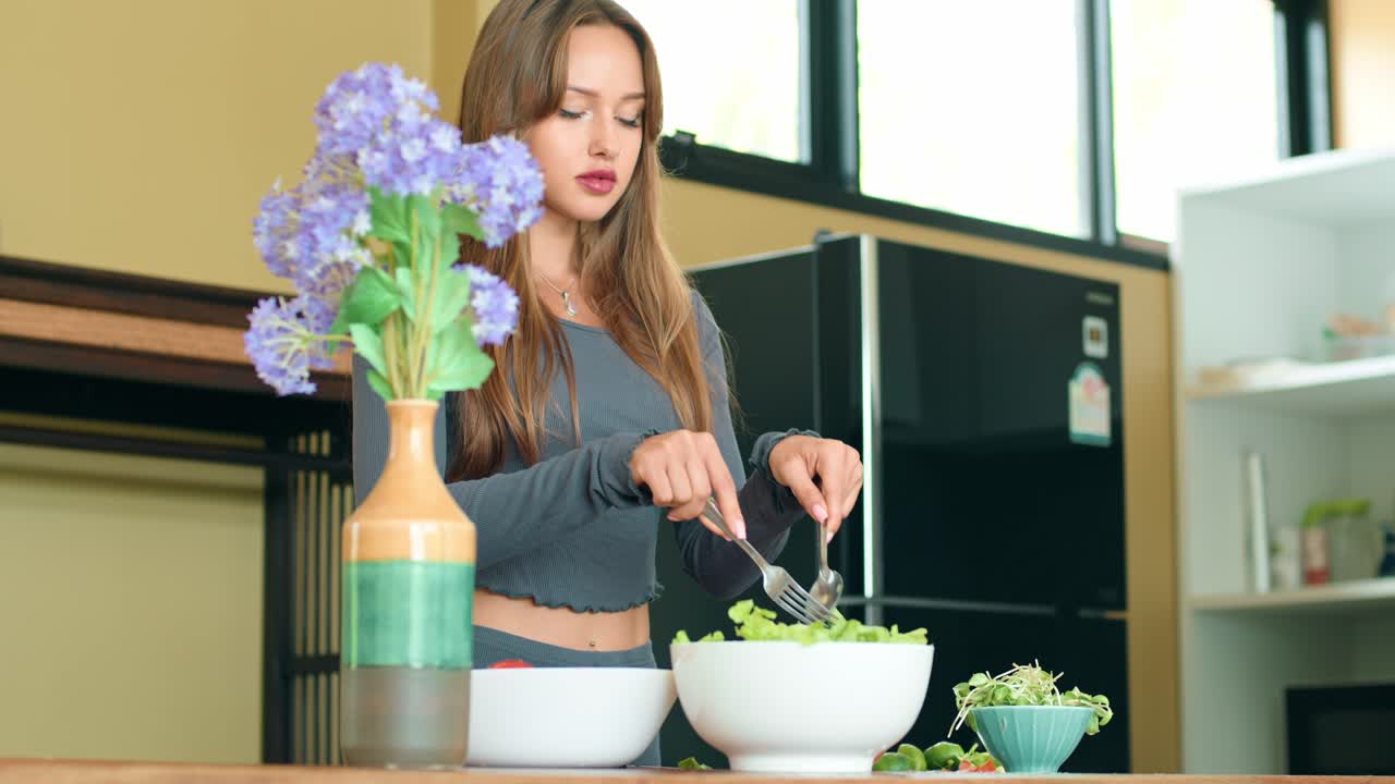 Woman Preparing a Salad in Kitchen