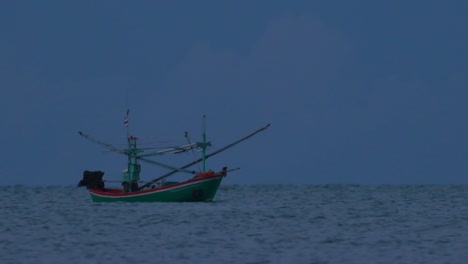 Fishing-Boats-in-Thailand-wait-in-the-middle-of-the-ocean-for-dark-to-come-so-they-can-turn-on-their-green-lights-and-start-fishing-and-troll-for-shrimps