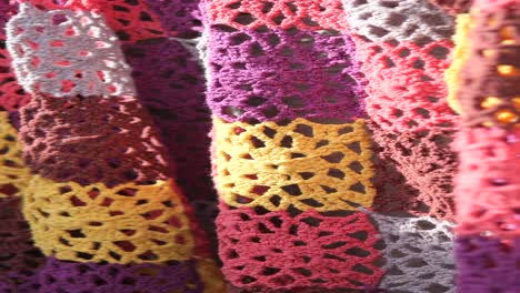 closeup of a multicolored crochet blanket