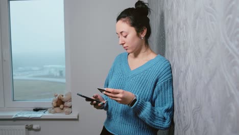 young-girl-enters-credit-card-information-into-the-phone