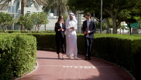 three people talking about business