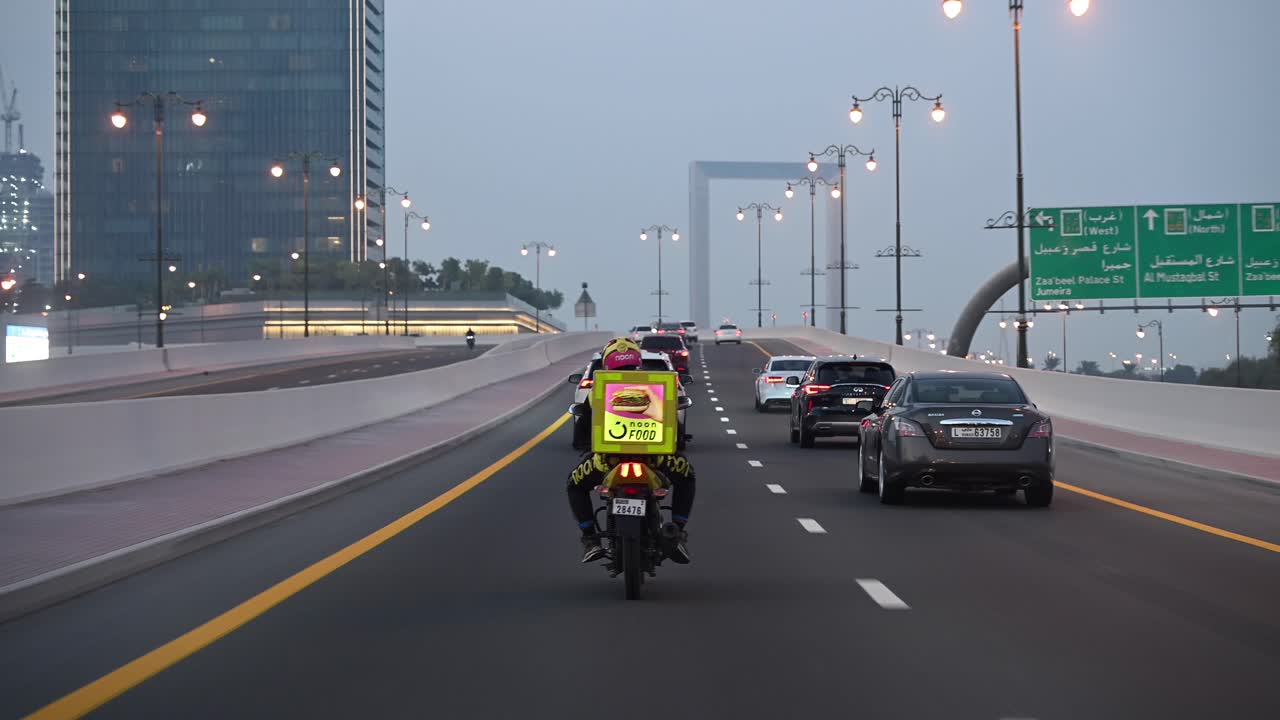 A delivery rider on his way to deliver food in Dubai.